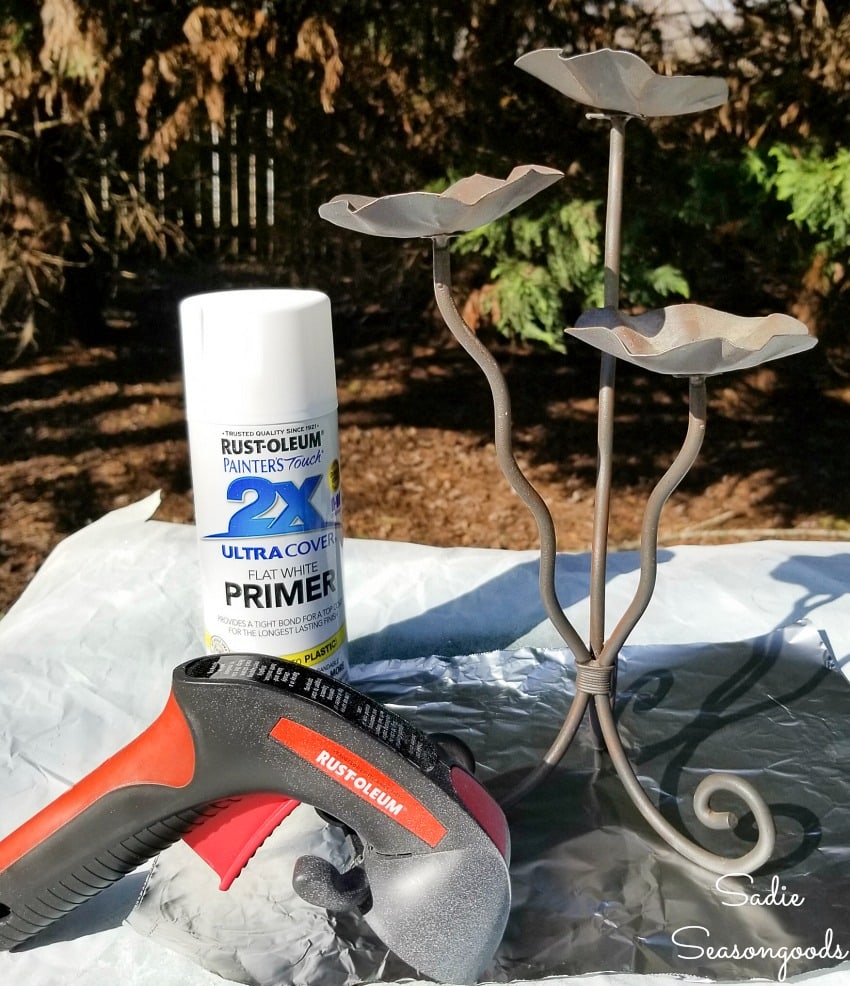 spray painting the metal candle holders