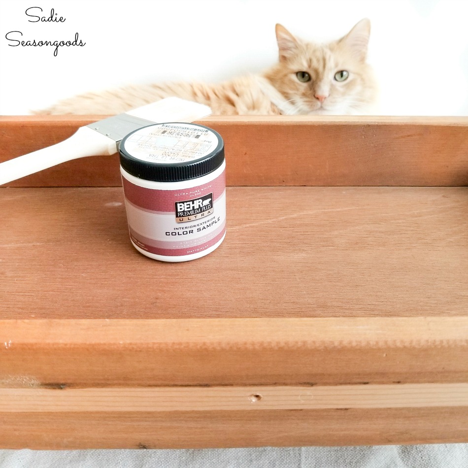 Painting the old drawers with samples of latex paint