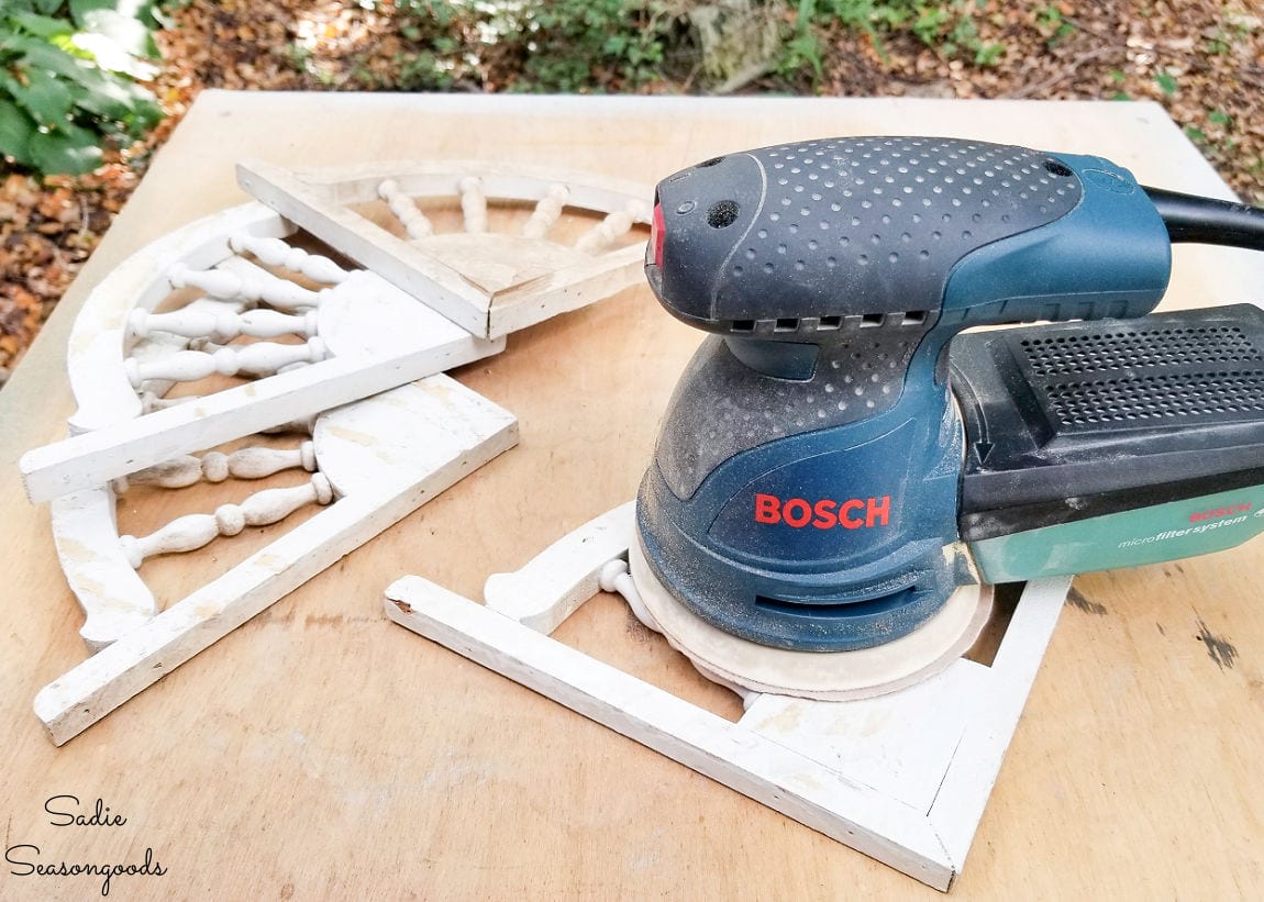 Sanding the decorative corner brackets