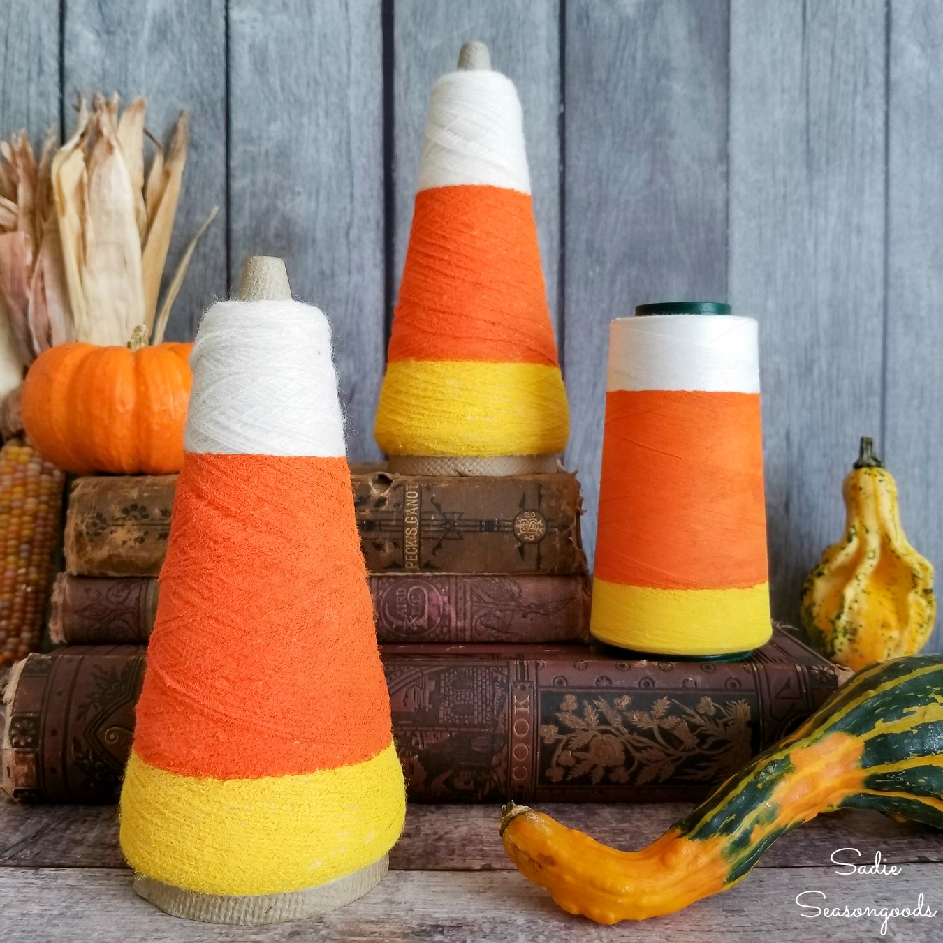 Candy corn decorations from thread cones for cute Halloween decor