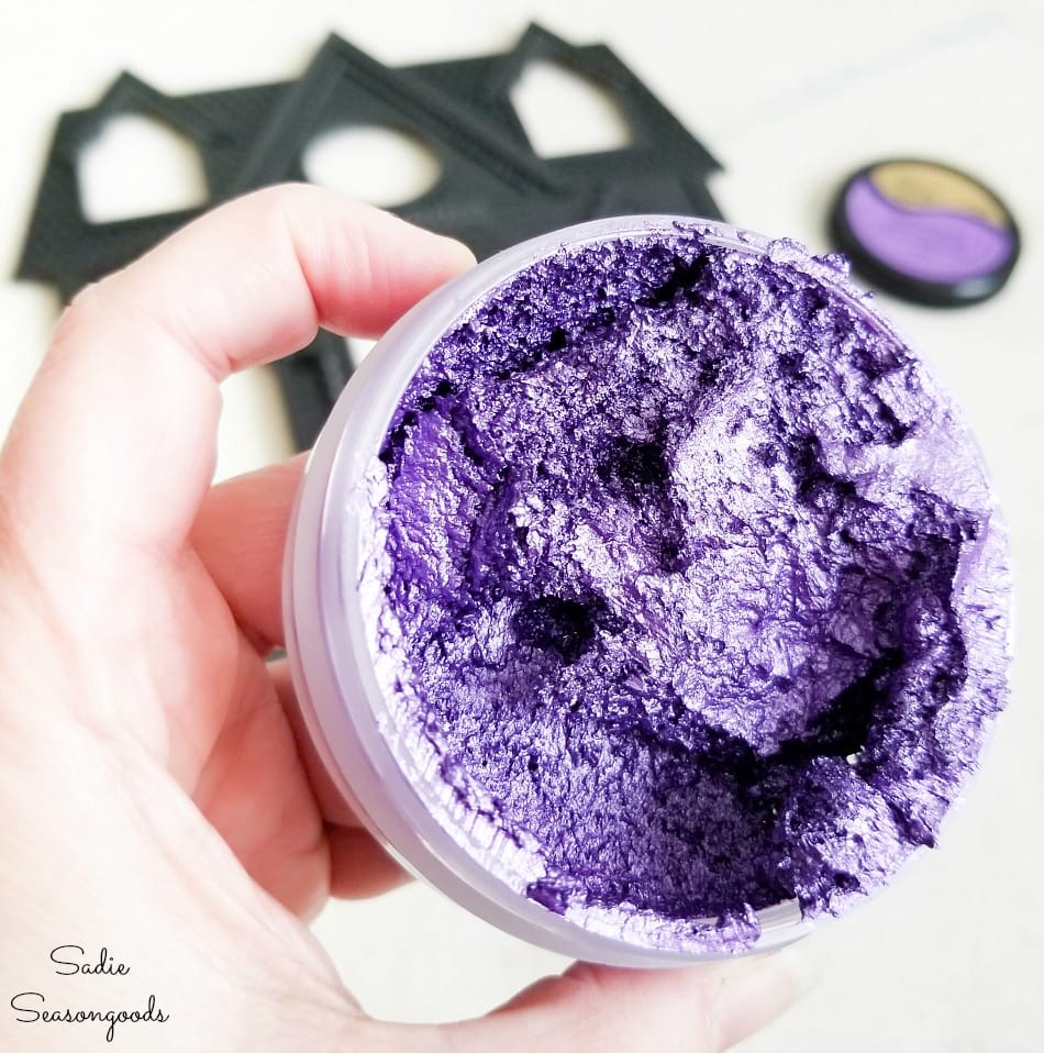 Decorating the haunted house decor with metallic purple wax