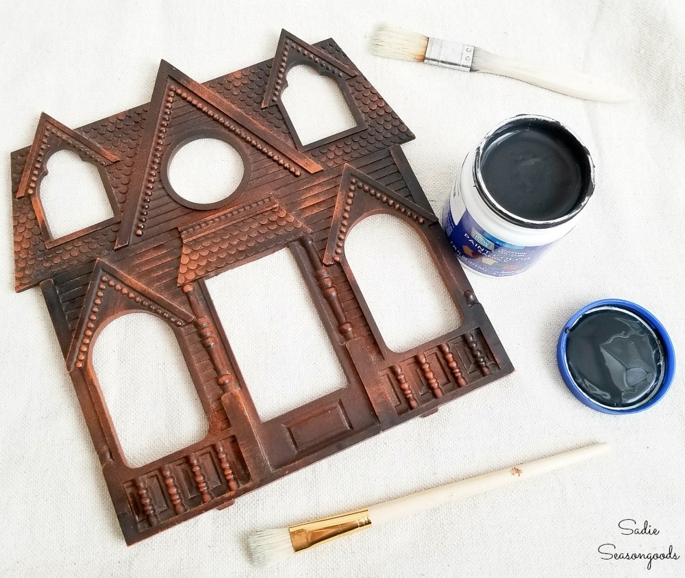 Painting a house shaped picture frame with black paint