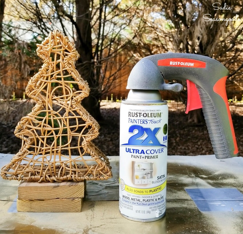 Spray painting a metal nesting basket with white paint