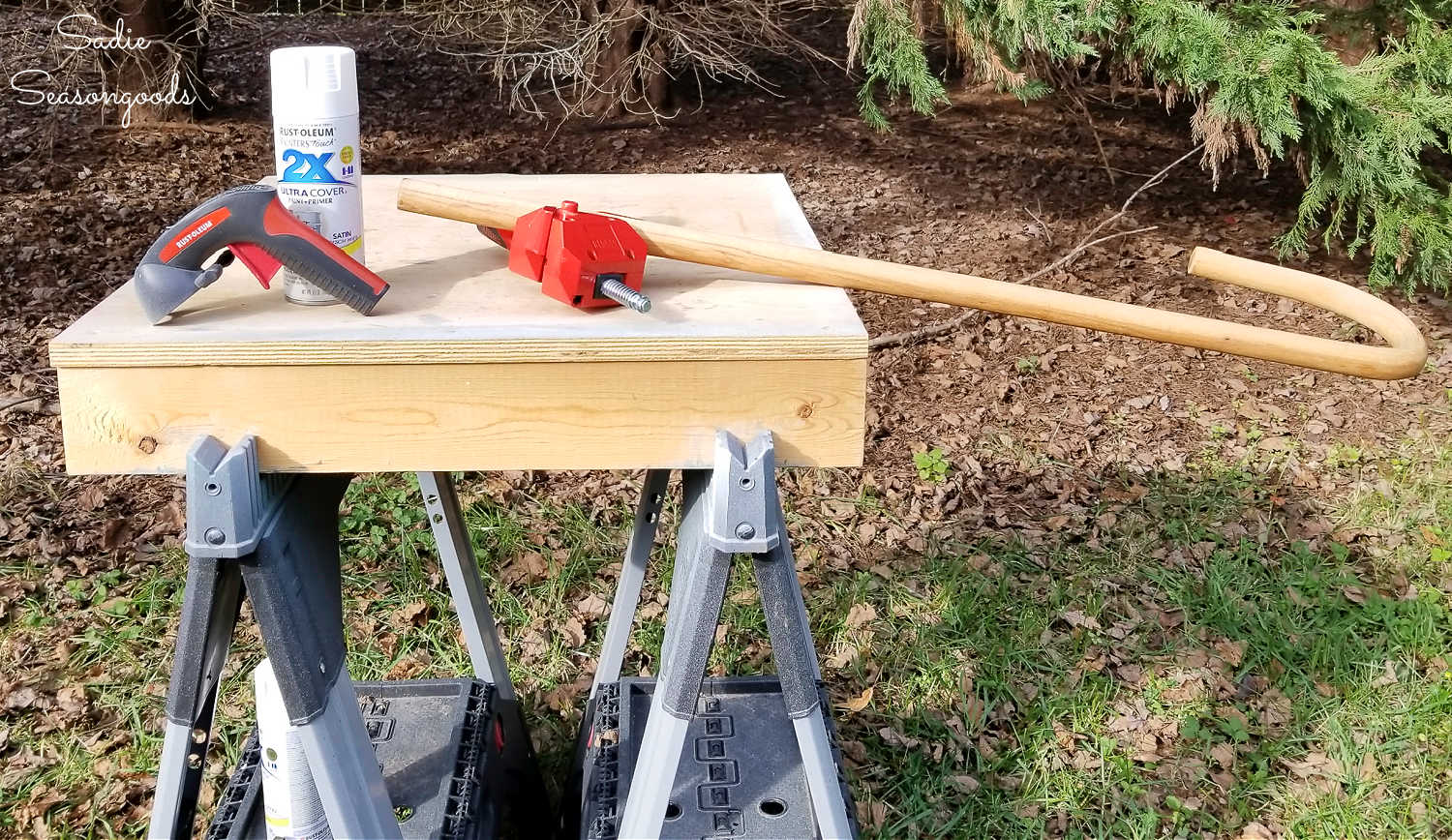 spray painting a wooden walking cane