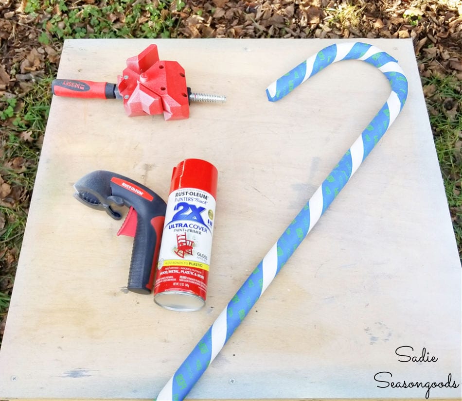 taping the stripes for diy candy cane decorations