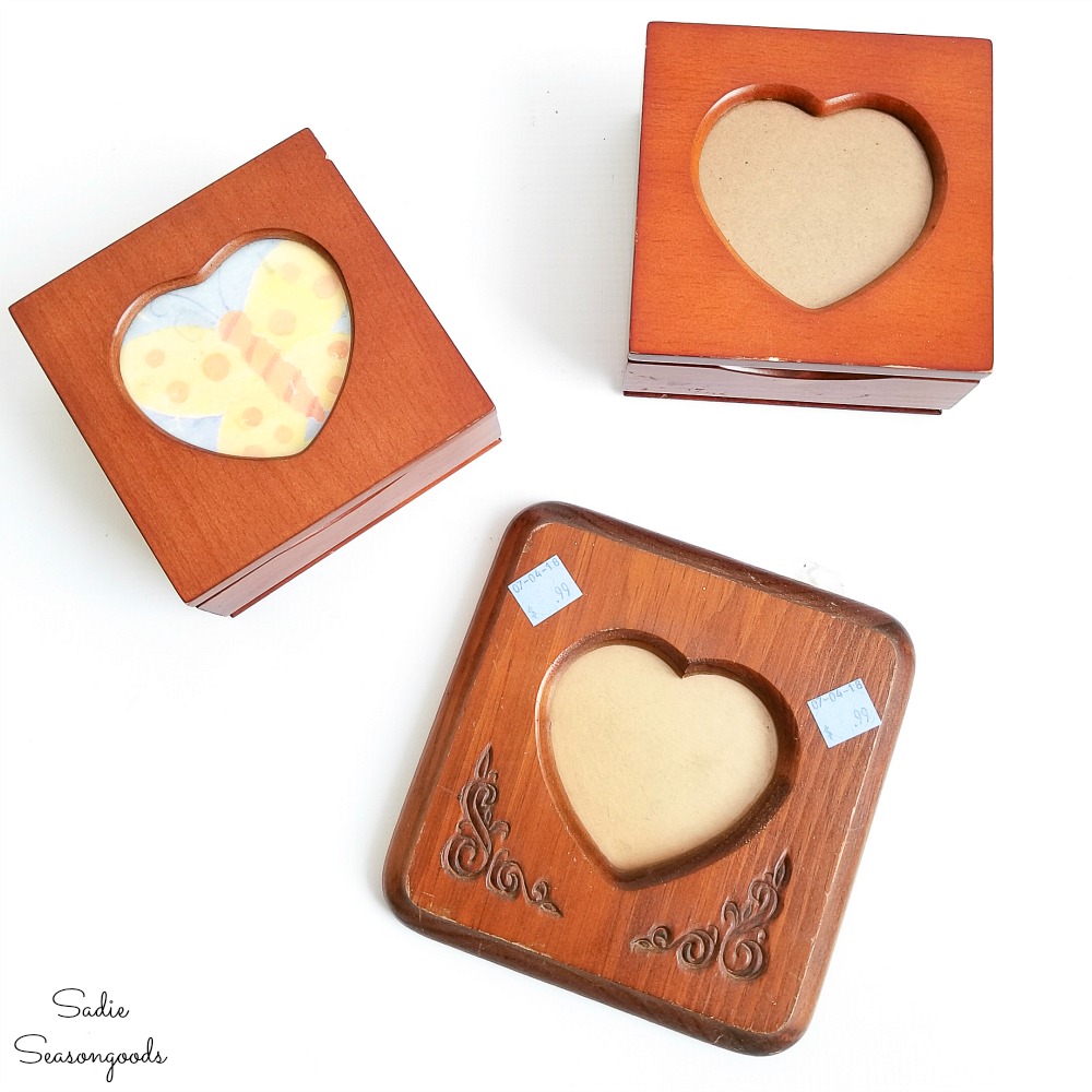 Thrift store decor for Valentine's Day with mini jewelry boxes and wooden picture frame