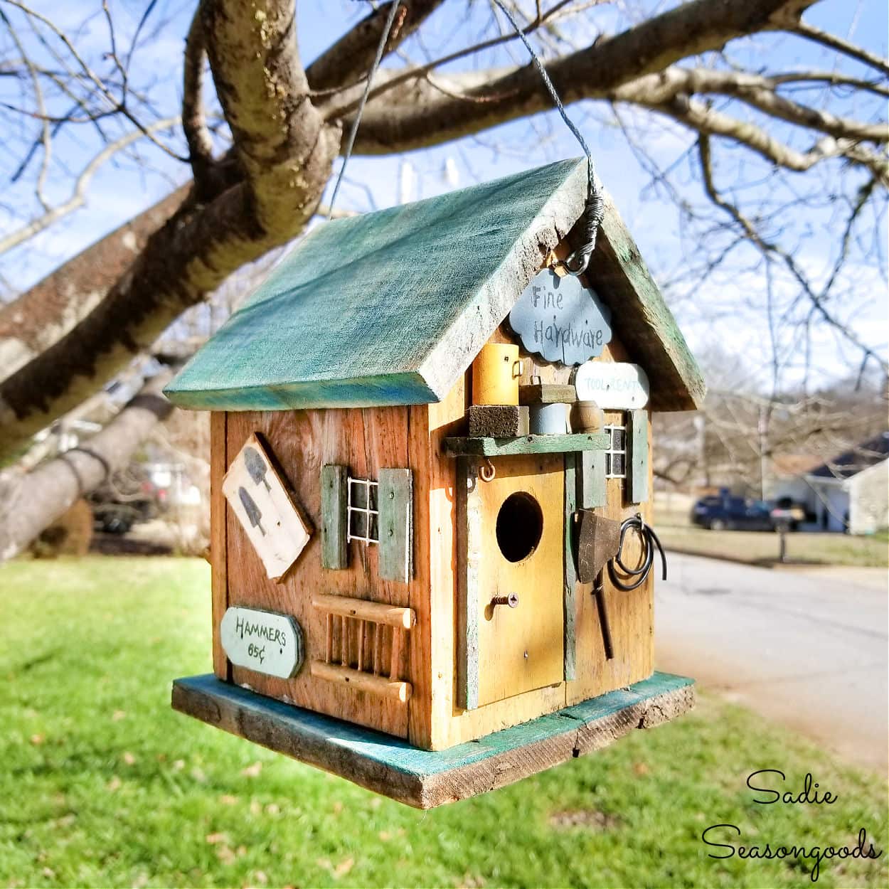 repairing a rustic birdhouse with barnwood