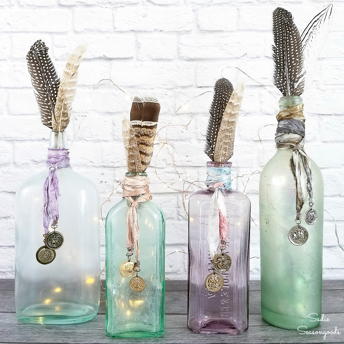 Old Bottles and coin charms as Boho decor ideas and bohemian vases