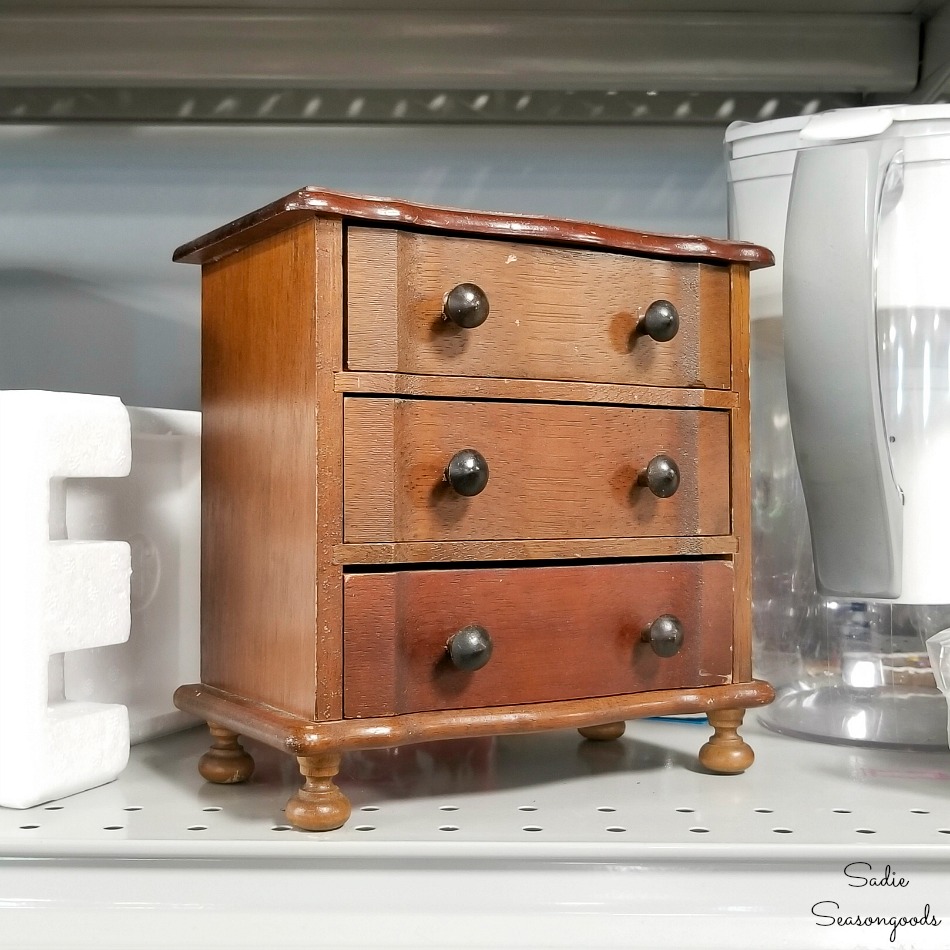 Wooden music box and mini chest of drawers at a thrift store