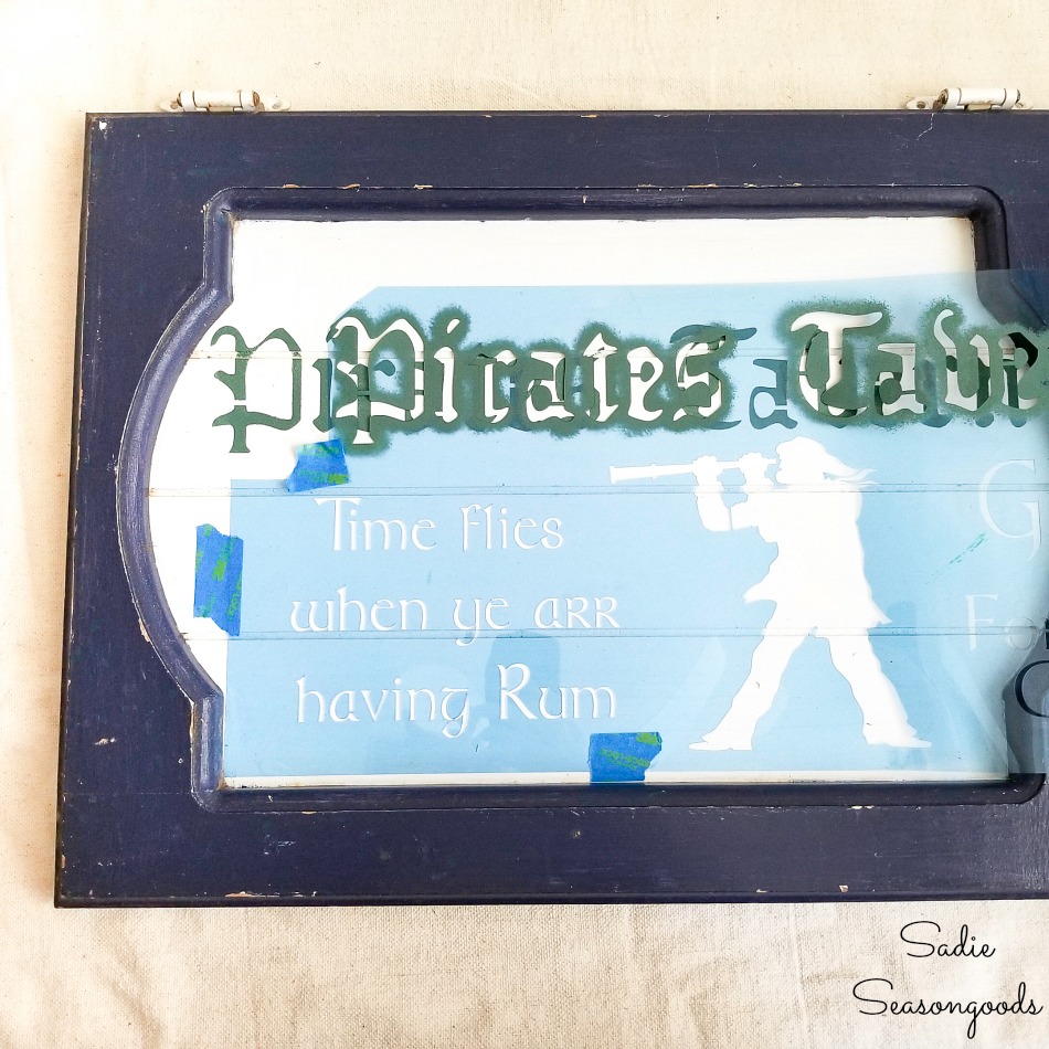 Using a pirate stencil to make the nautical decor