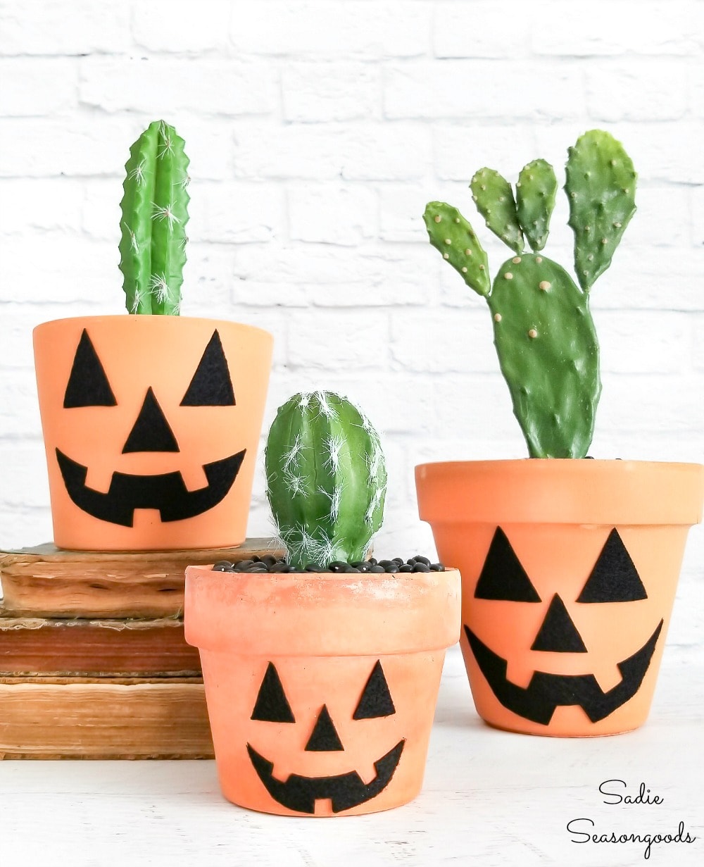 Boho halloween decor with terracotta jack o lanterns