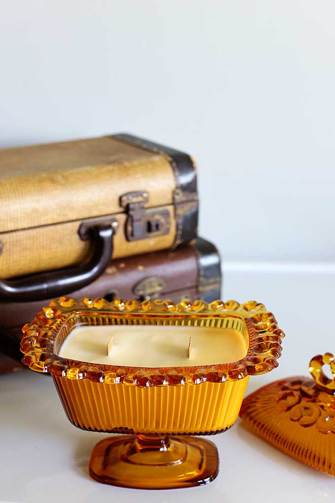 Candy dish or colored glassware that has been upcycled into a candle