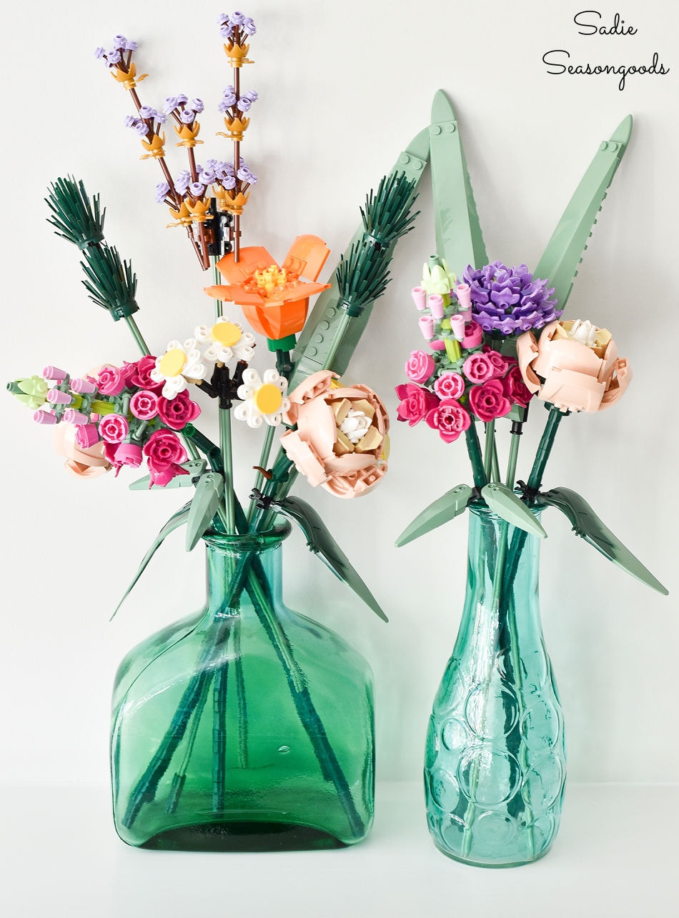 lego flowers in vintage glass bottles