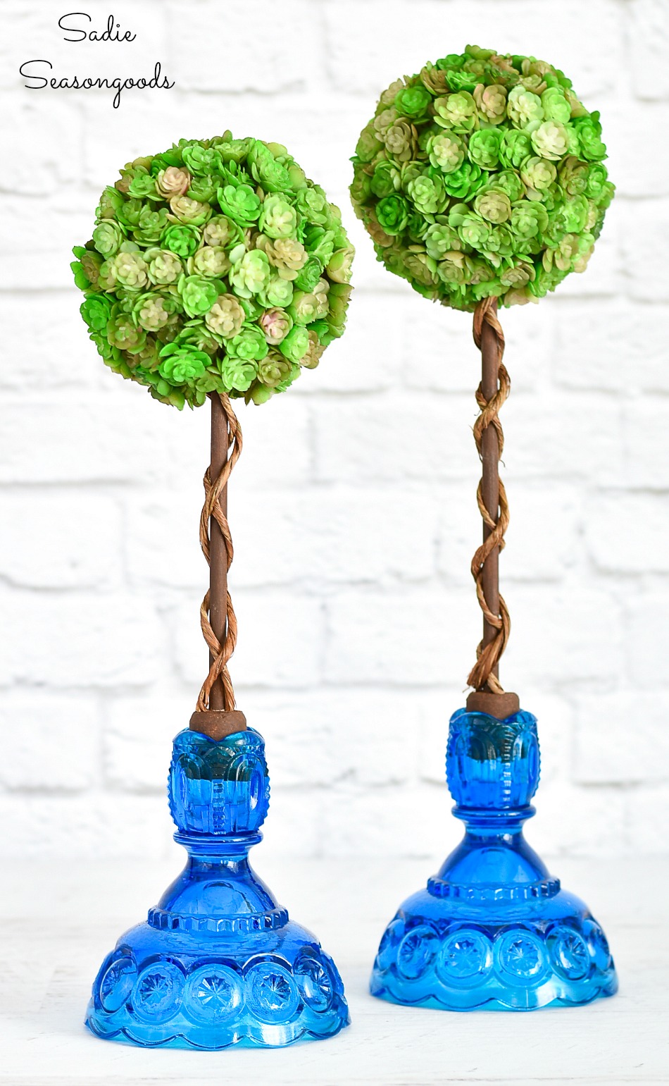 Spring topiaries with vintage candlesticks and wine corks