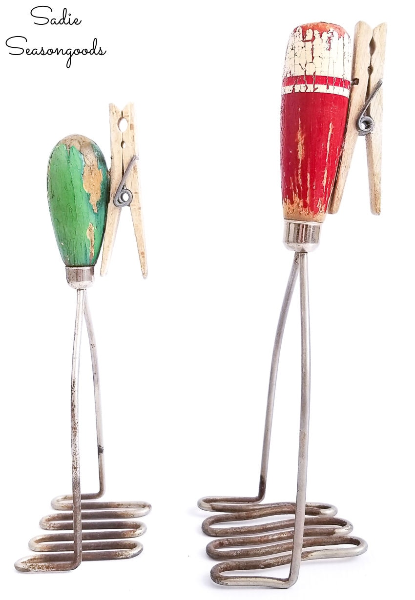 vintage kitchen utensils as a recipe stand