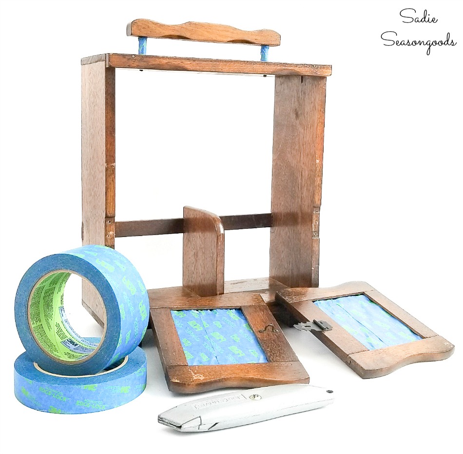 Preparing a wooden caddy for spray painting with painter's tape