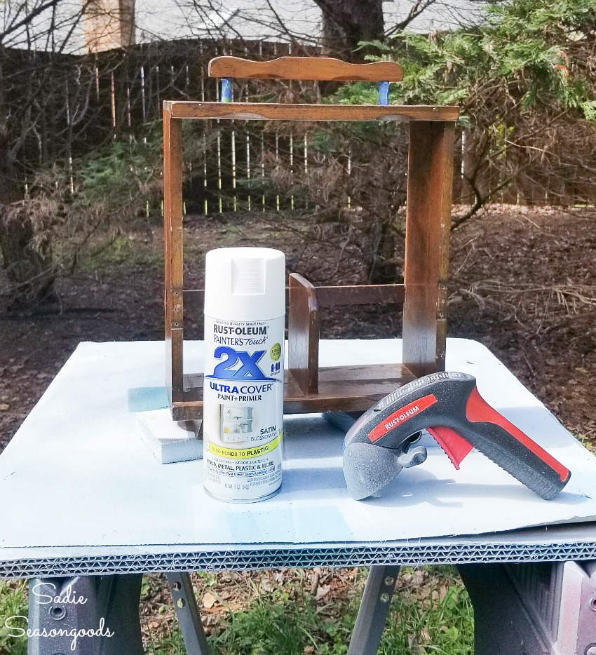 Spray painting a wooden caddy for liquor decanters