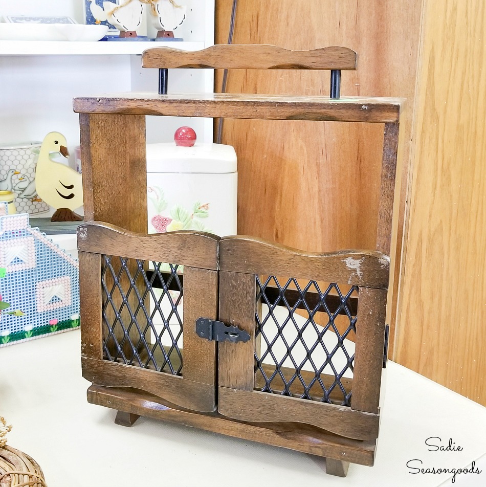 Wooden caddy for liquor decanters at a thrift shop