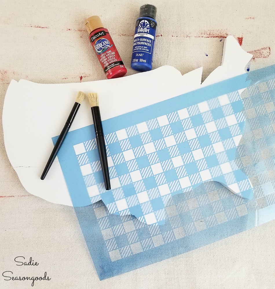 Using a buffalo plaid stencil to create the flag decor