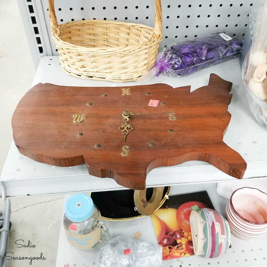Wooden USA and broken clock at a thrift store