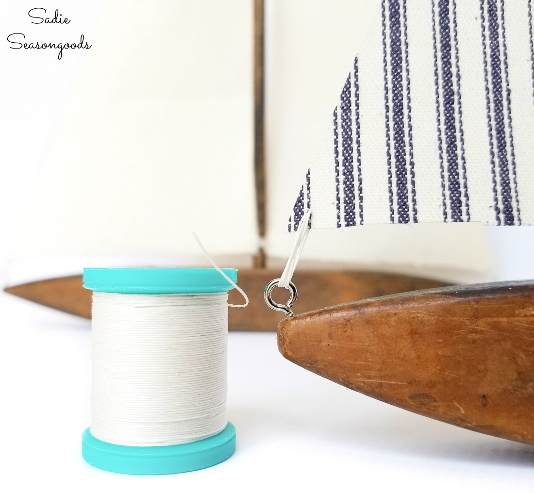 Craft thread to tie the sails to the decorative sailboats