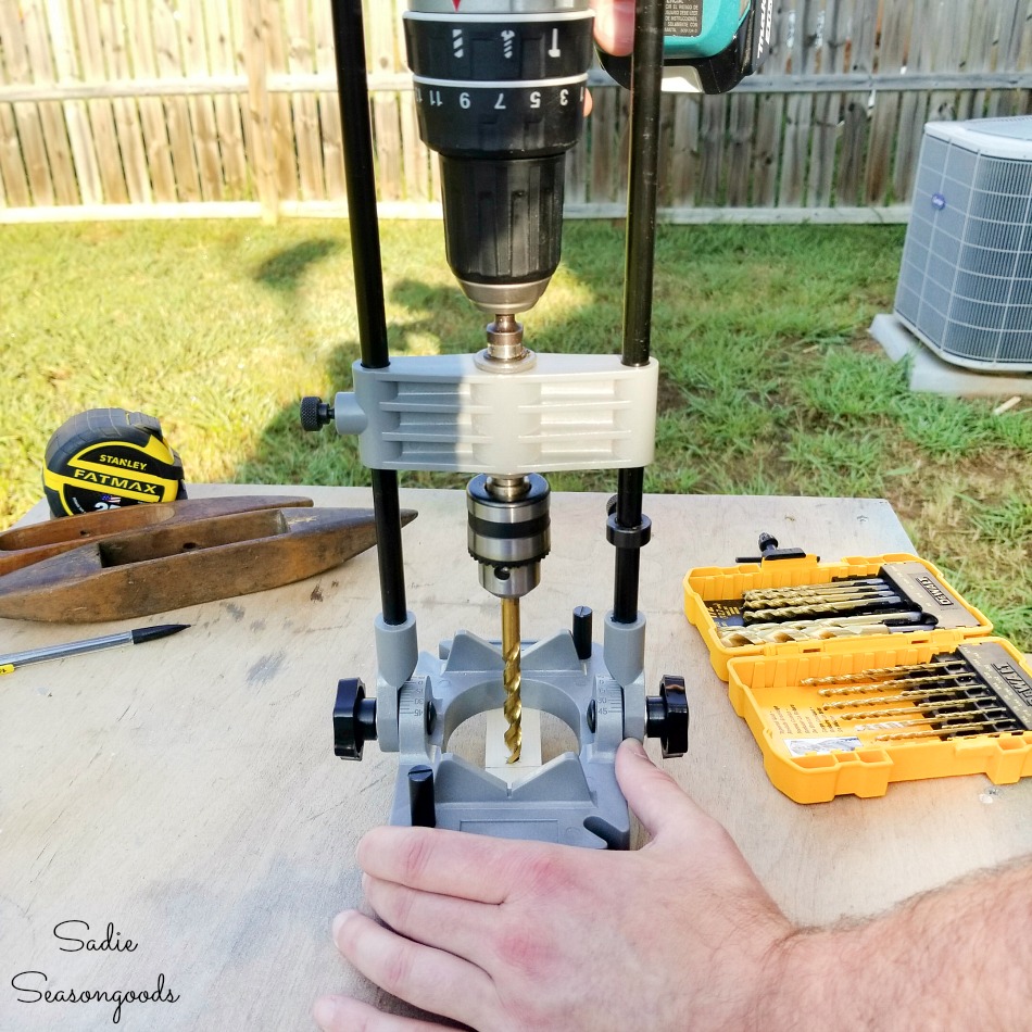 Drill guide to create straight holes for a mast