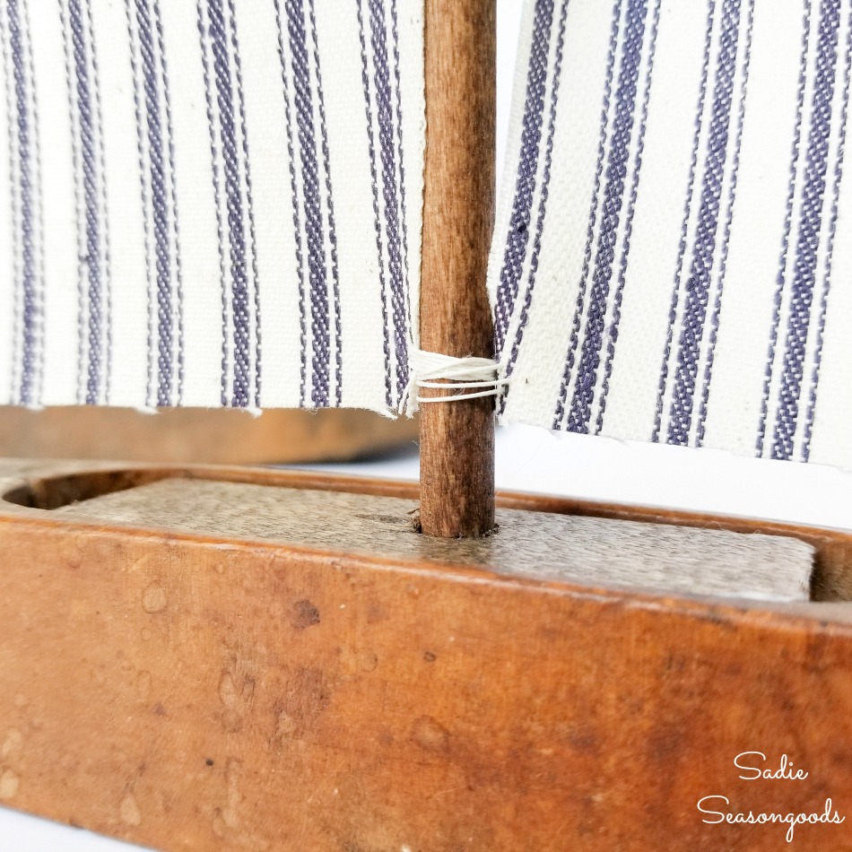 Upcycling a loom shuttle as sailboat decor