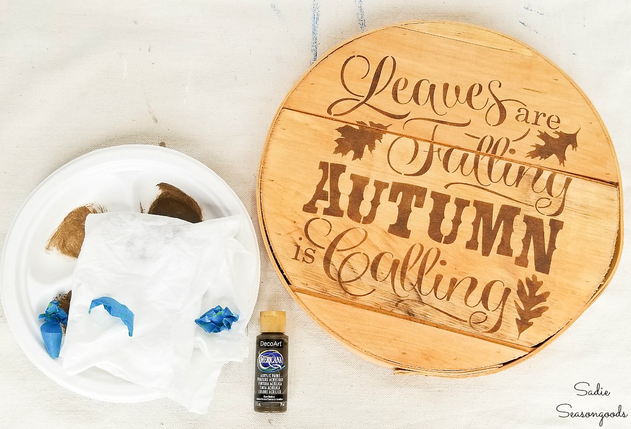 Wood burned sign with stencils and brown paint