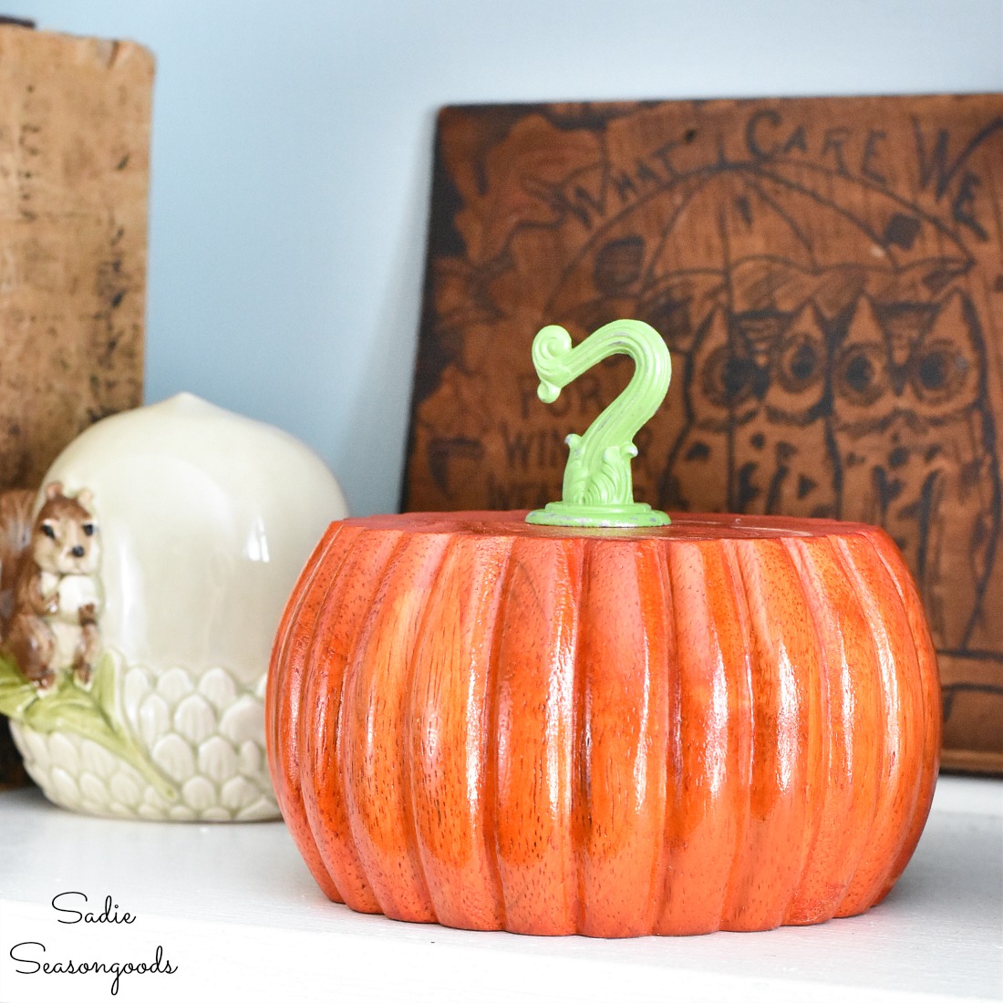 Colorful wood pumpkins with wood dye on bun feet