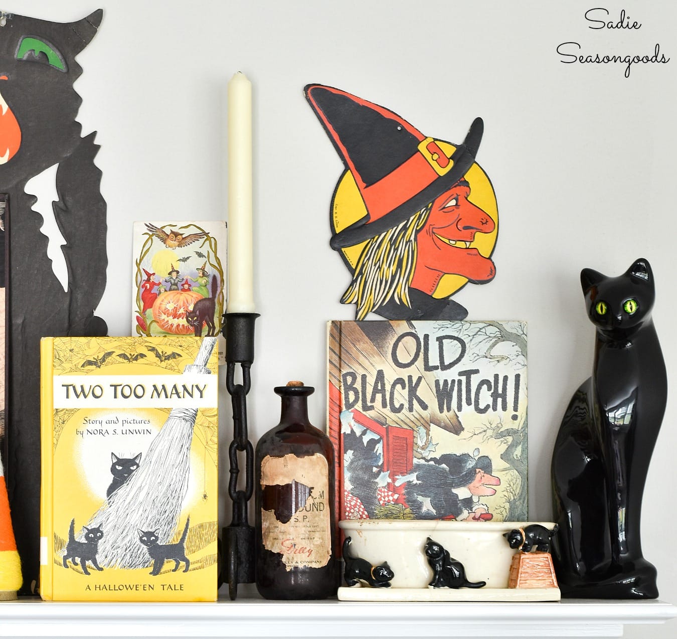Children's Halloween books and vintage black cat decor