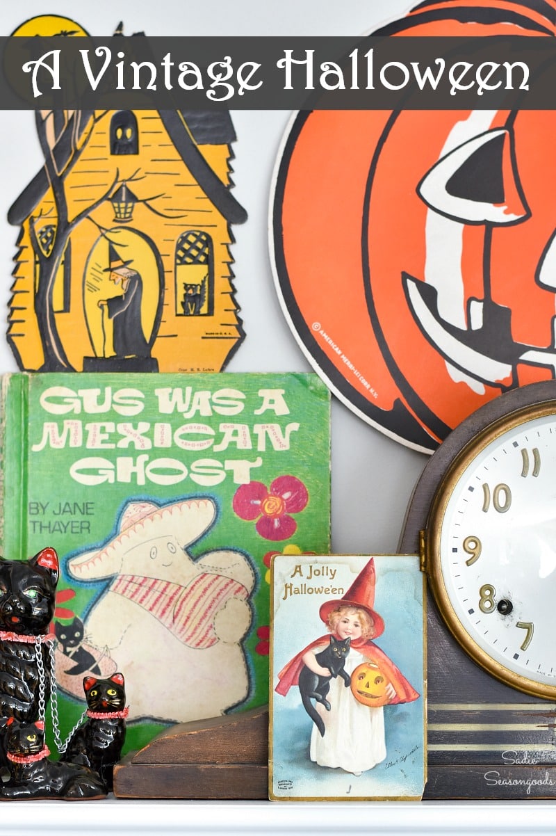 Decorating a Halloween mantel with vintage door hangers and postcards