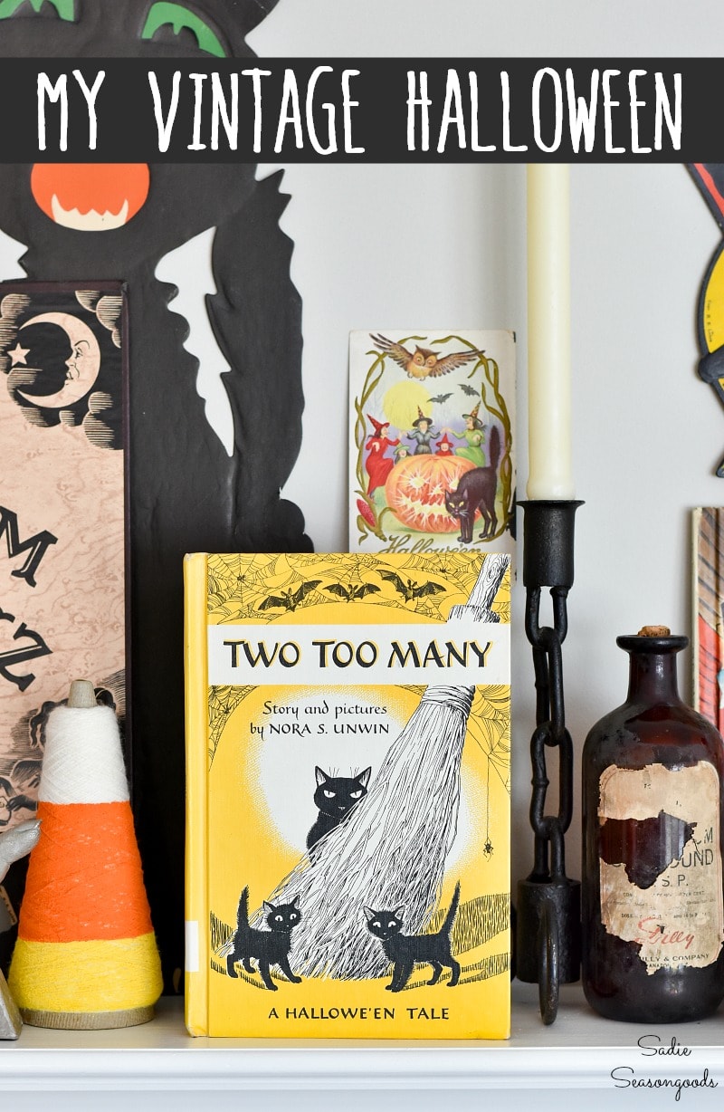 Halloween door hangers and Vintage Halloween postcards on a mantel