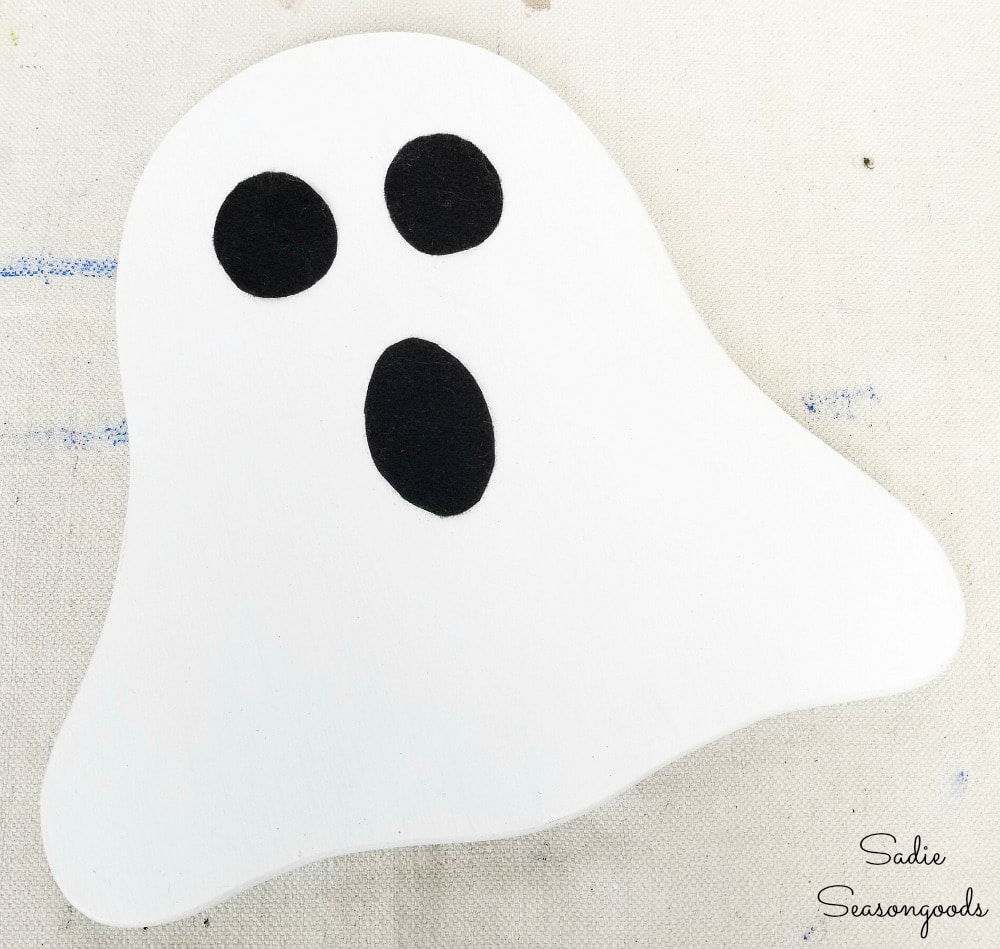 Halloween ghost decor from a vintage cheese board