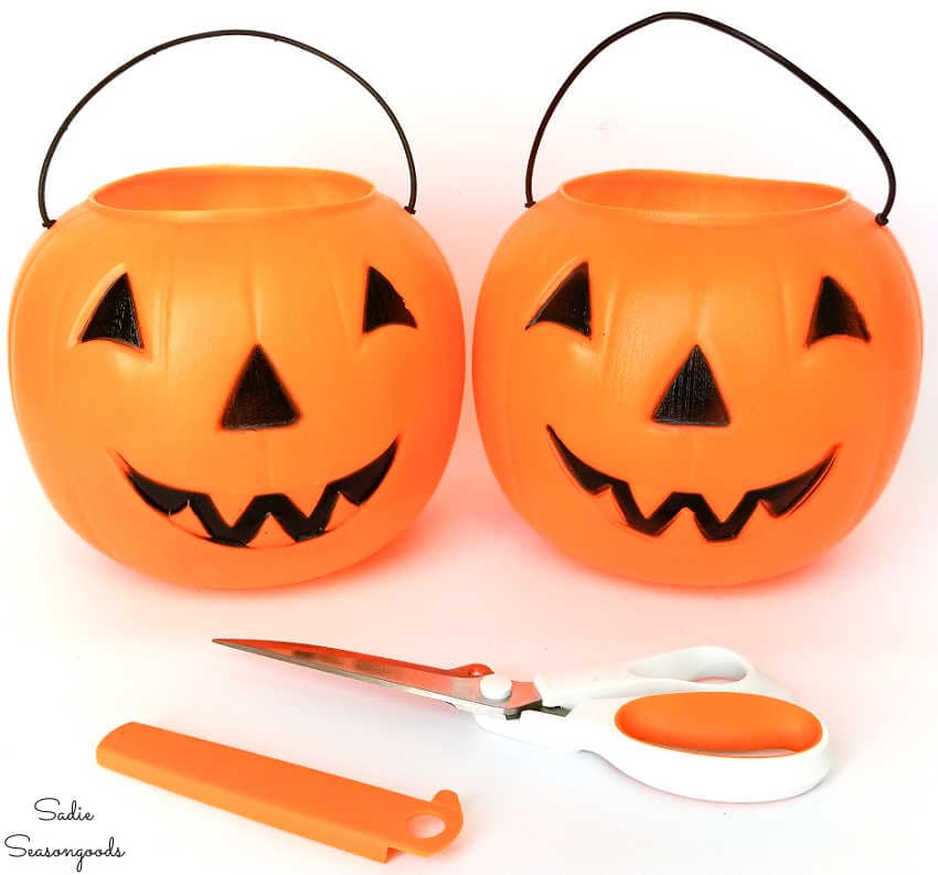 cutting the handle off a plastic pumpkin bucket