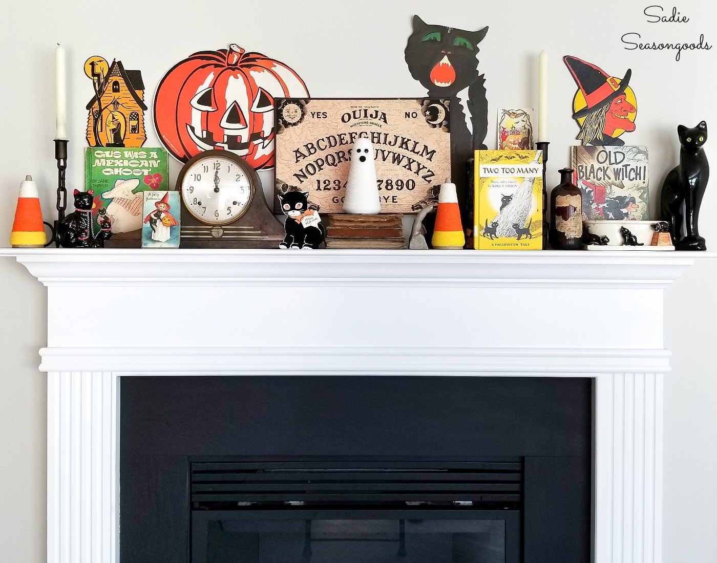 Vintage Halloween decor on a fireplace mantel