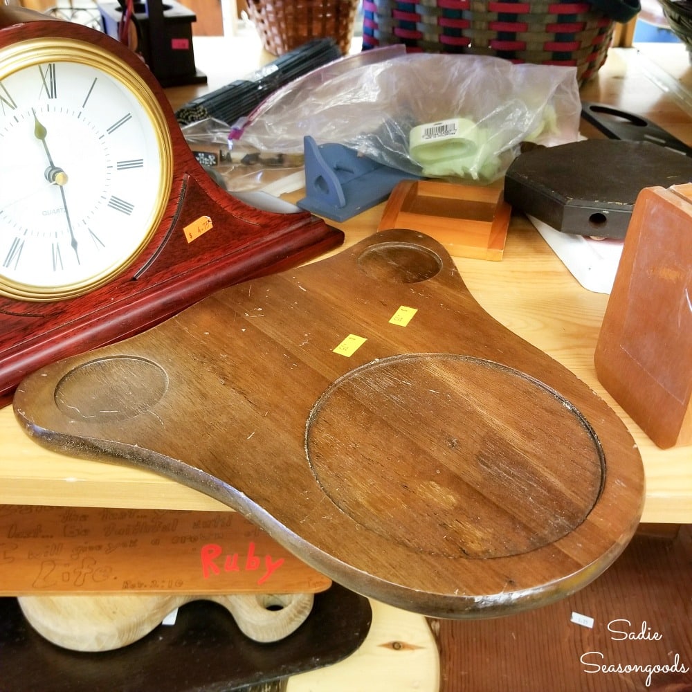 Wooden cheese board at a thrift store