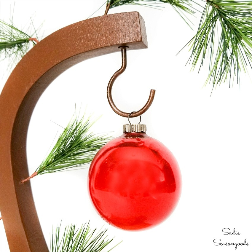 Red ornament on a Charlie Brown Christmas tree