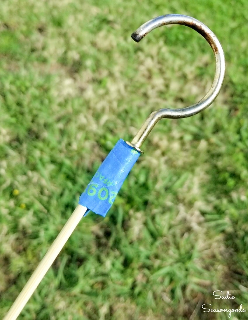 Taping hardware to a bamboo skewer for painting