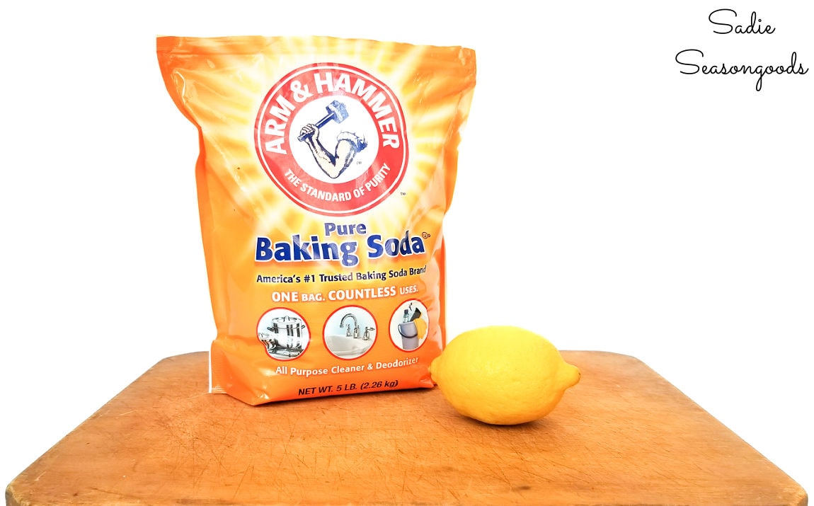 cleaning a wooden cutting board with baking soda and lemon