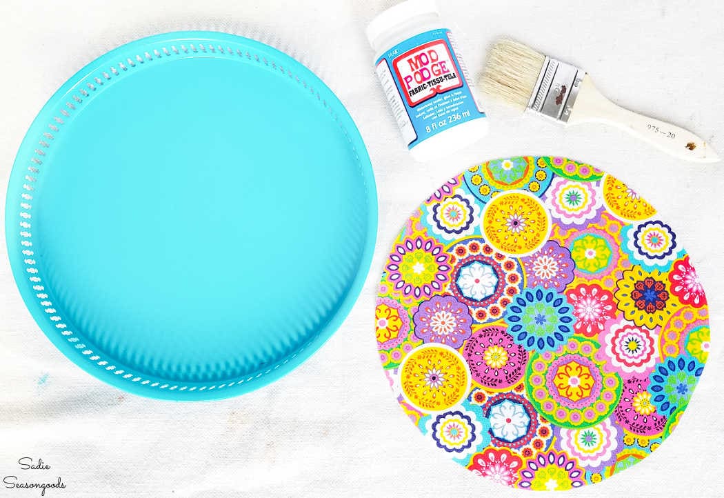 decoupaging fabric on a metal serving tray