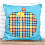 blue fall decor with a pumpkin throw pillow