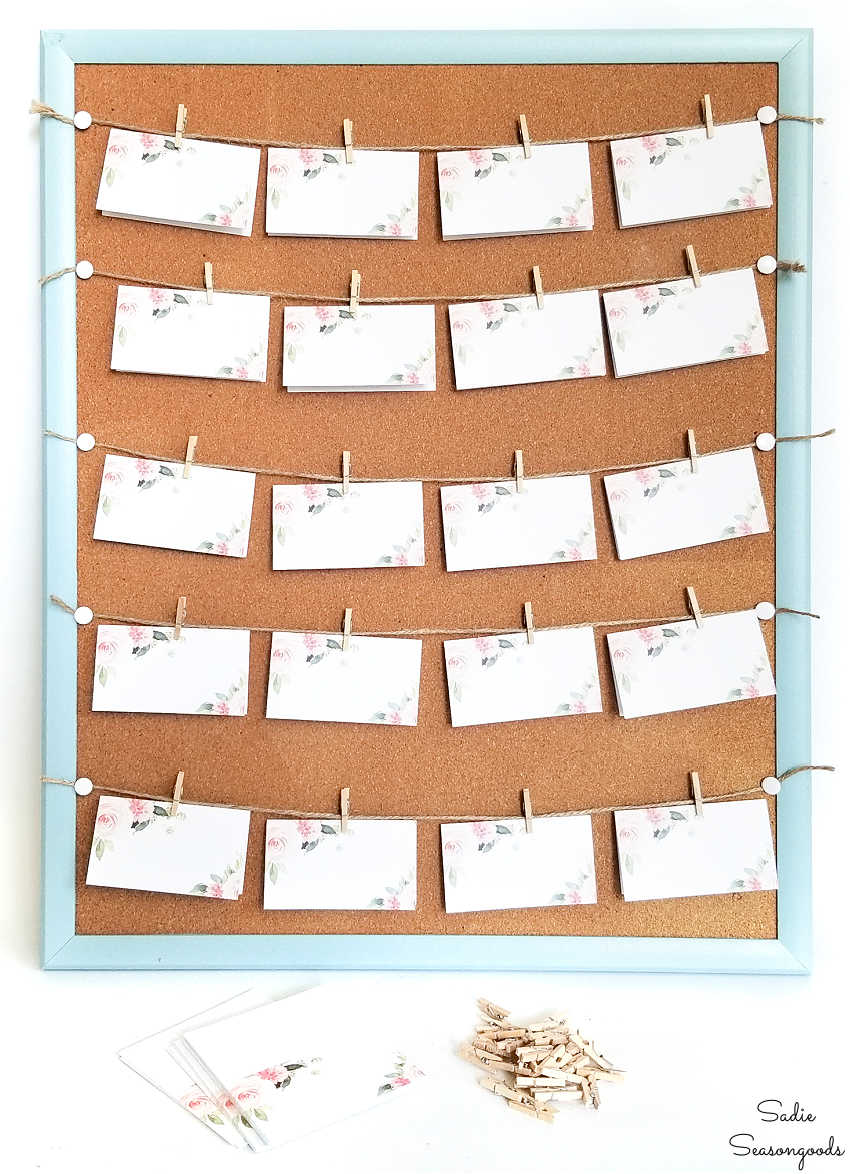 rustic wedding seating chart on a corkboard