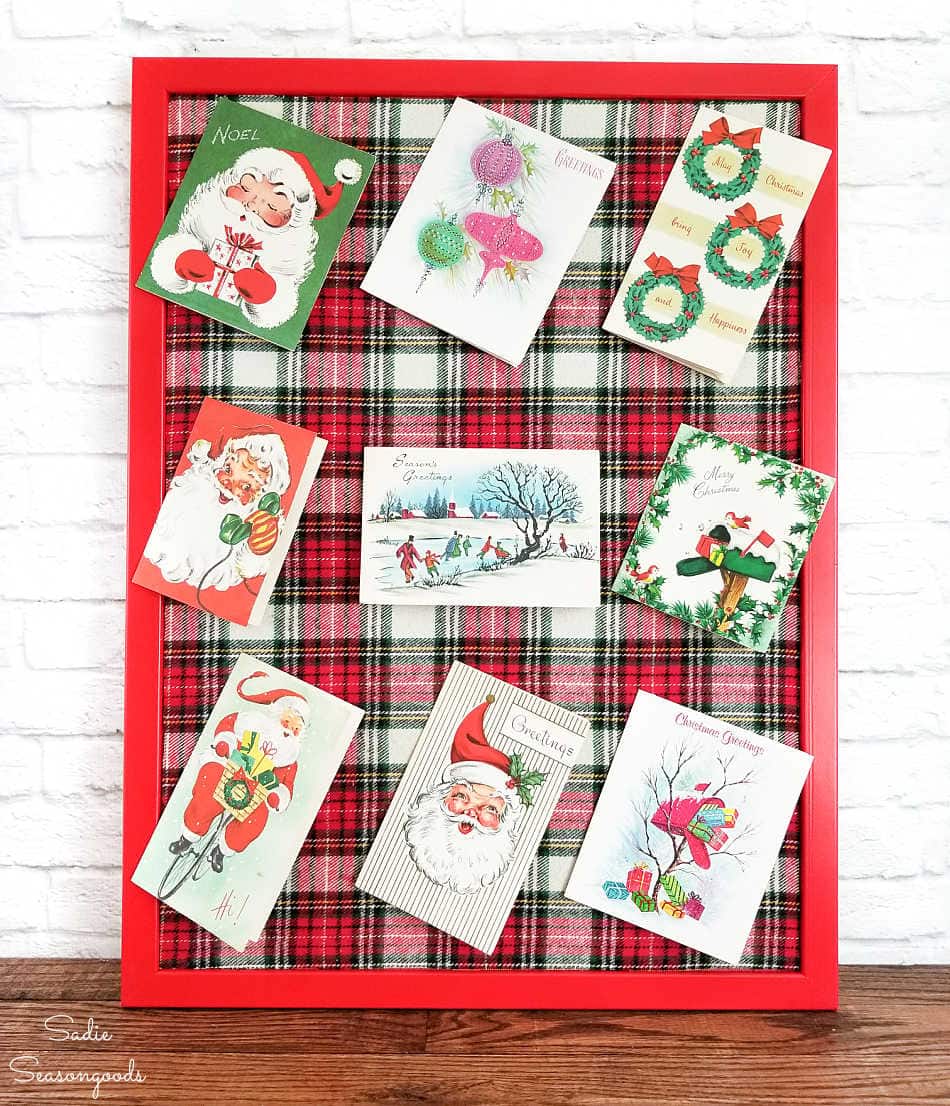 christmas card display on a cork board