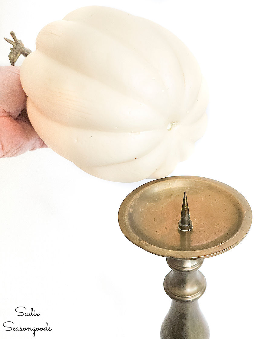 using a vintage brass candlestick to displace a foam pumpkin