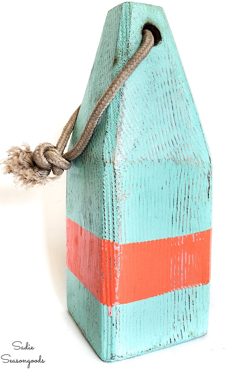 lobster buoy in orange and turquoise