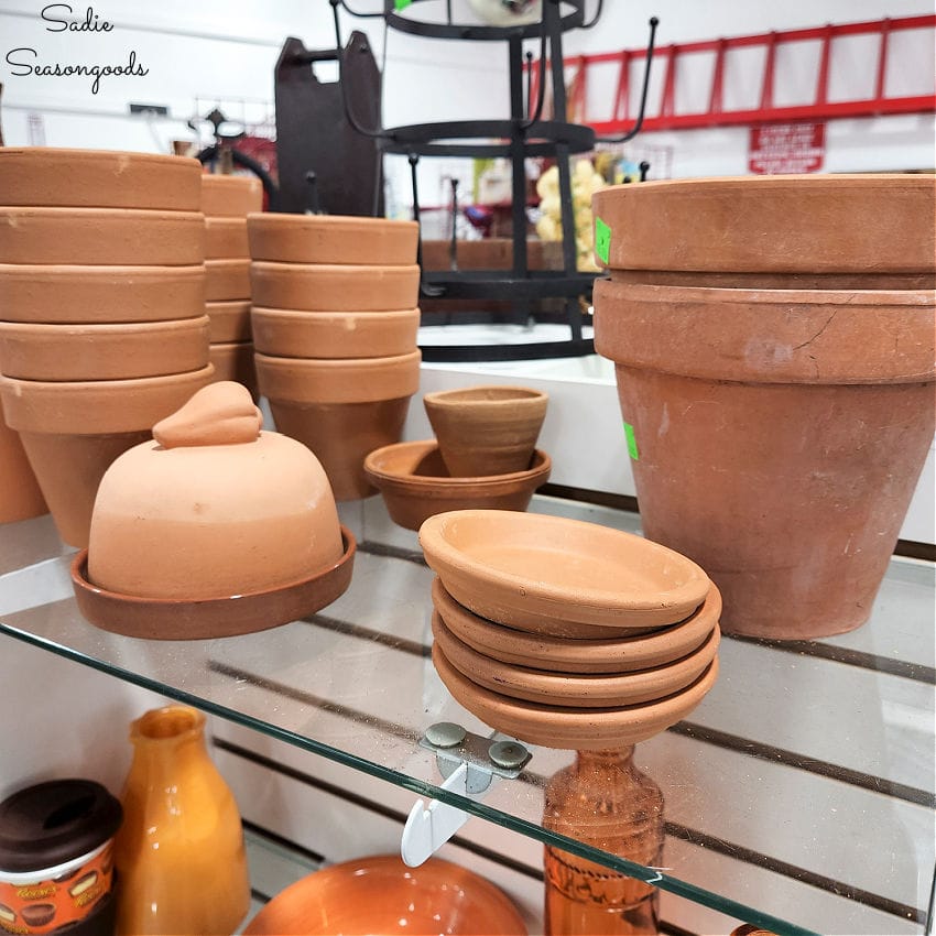 plant saucers and flower pots at a thrift store