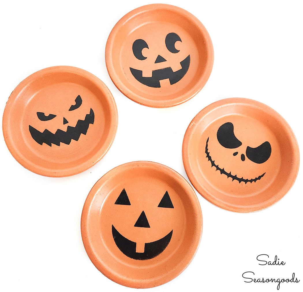 terracotta jack-o-lantern coasters for halloween from plant saucers