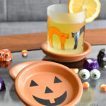 pumpkin coasters that are made from plant saucers for flower pots