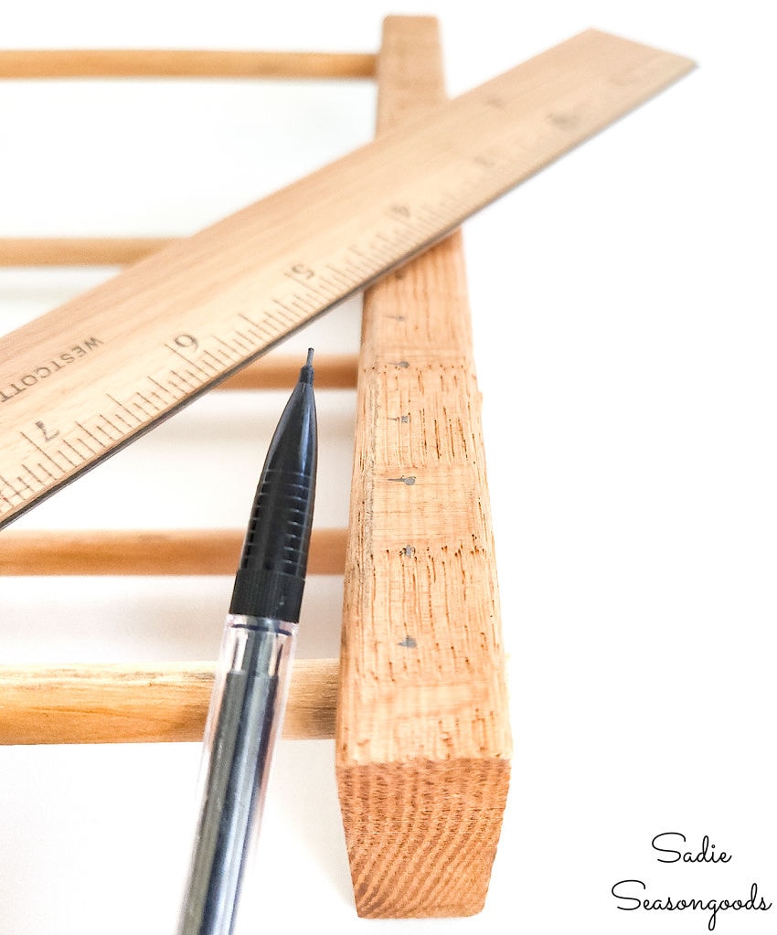 marking and measuring the nail holes on a diy loom