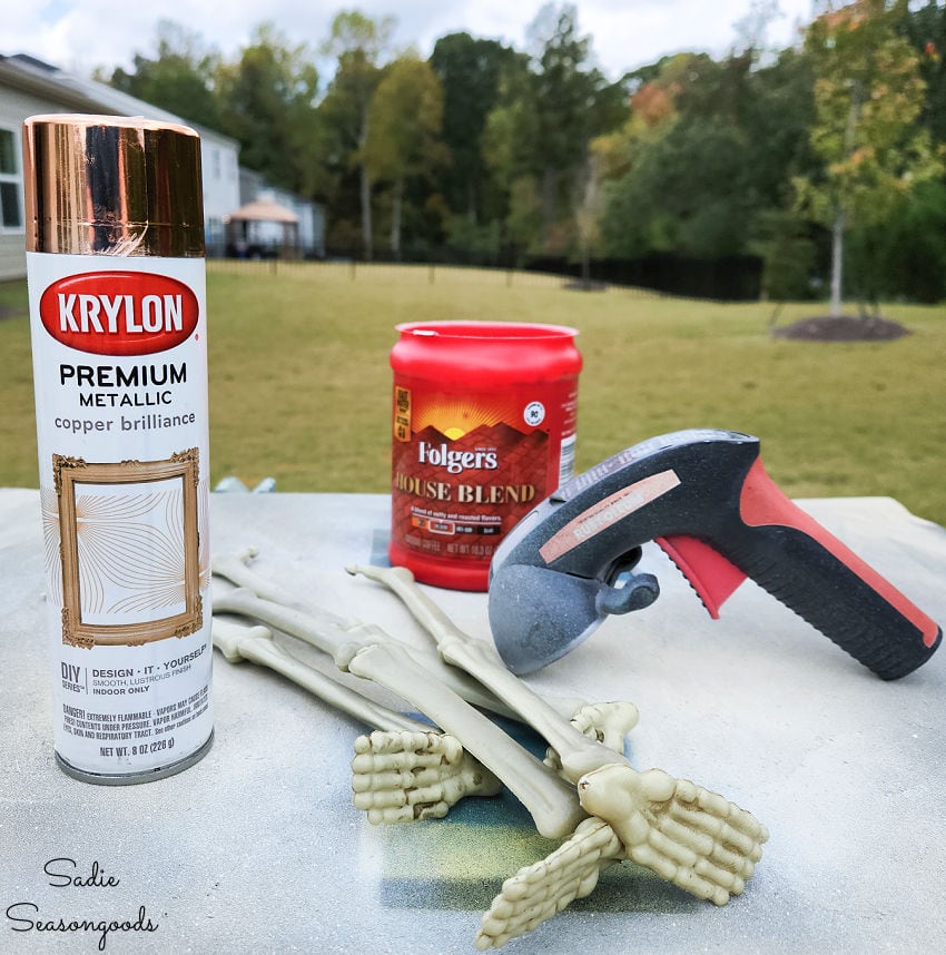 painting the plastic skeleton feet to use for a footed tray